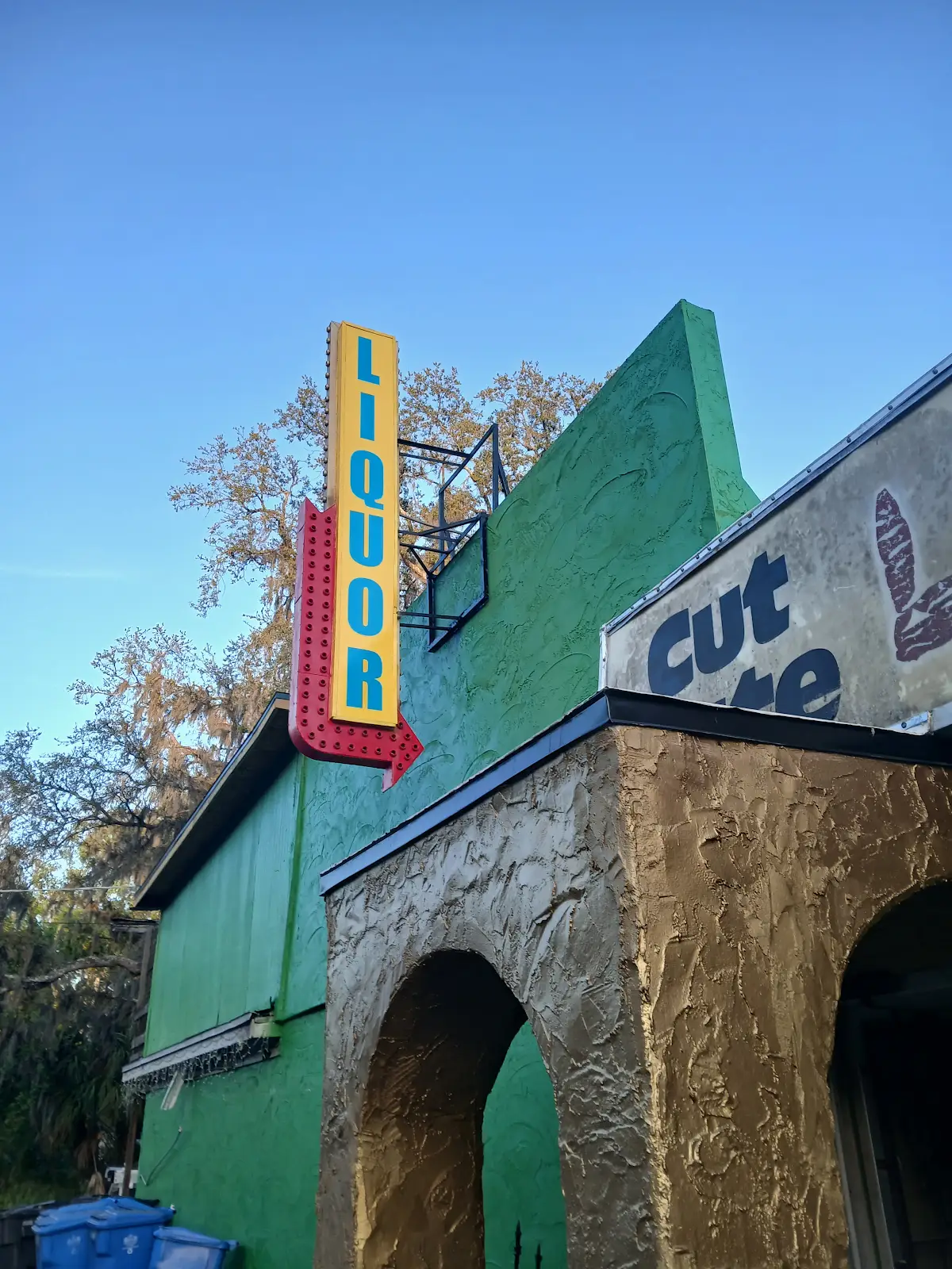 Out front — the Liquor sign